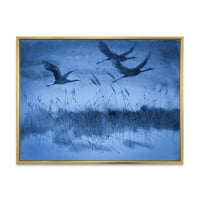 DesignArt 'Dizalice u letu tijekom plave večernje svjetlosti' Tradicionalno uokvireno platno zidne umjetničke print