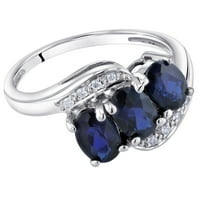 Oravo 1. CT Oval stvorio plavi safir i dijamantski prsten s tri kamena u 14k bijelom zlatu
